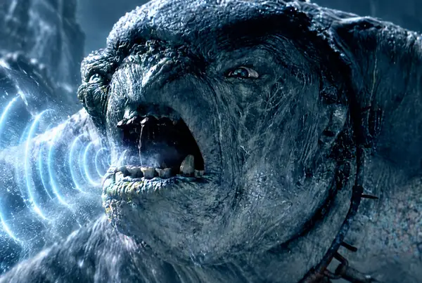 Close-up of a blue, snarling fantasy monster