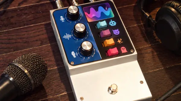 Colorful guitar effects pedal with control knobs